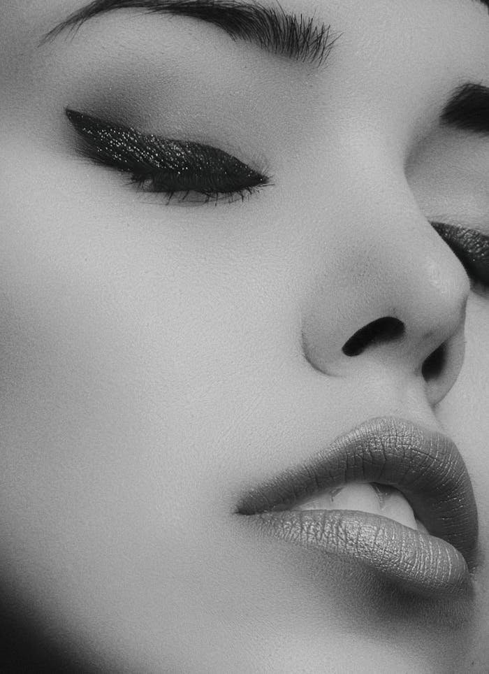 creative-03 Artistic black and white close-up portrait of a woman's face with glamorous makeup.